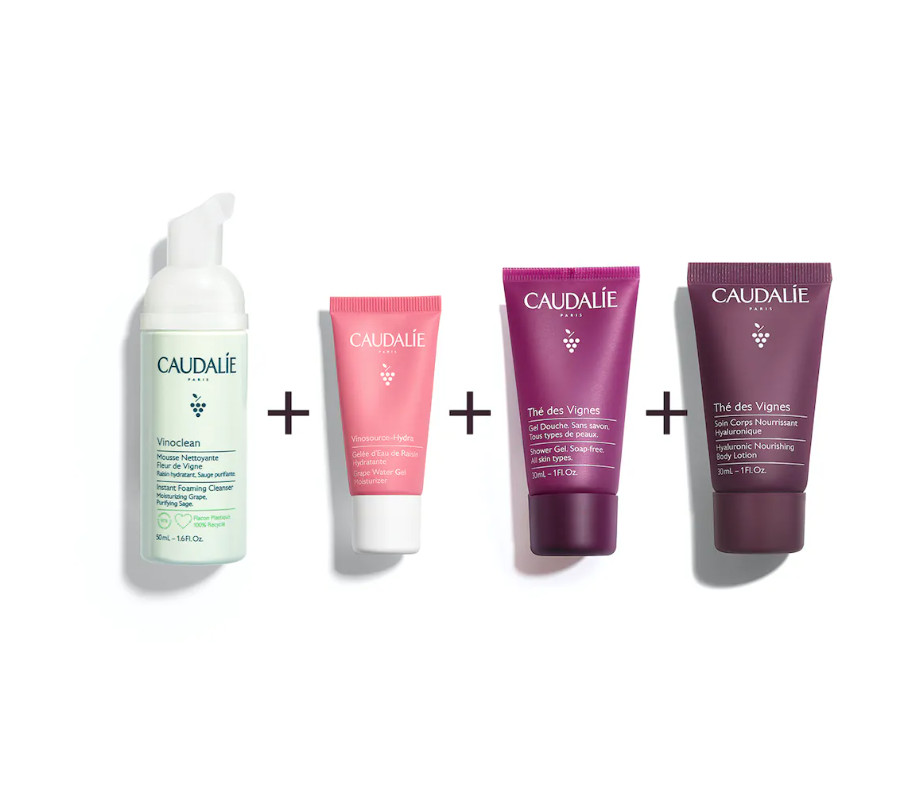 CAUDALIE Neceser Los Esenciales de Caudalie  Tipo de piel : Todo tipo de pieles Necesita : Hidratación & Pieles sensibles Ingredientes clave : Ácido hialurónico, Uvas , Almizcle blanco Use : Mañana y tarde, todos los días ¿Qué es?  Descubre nuestro neceser de verano: ¡Los Esenciales de Caudalie! Esta nueva edición limitada contiene 4 productos imprescindibles en formato de viaje en un bonito neceser que te hará ver la vida en rosa...  ¡Descubre nuestros tratamientos de culto para rostro y cuerpo! Regala a tu piel una limpieza suave y una hidratación intensa. El Neceser Los Esenciales de Caudalie contiene: una Espuma Limpiadora Fleur de Vigne Vinoclean 50 mL, un Gelcream de Agua de Uva Vinosource-Hydra 15 mL, un Gel de Ducha Thé des Vignes 30 mL y un Tratamiento Corporal Nutritivo Hialurónico Thé des Vignes 30 mL.